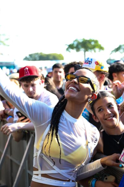 Vibra Urbana Miami 2022 Vibra Urbana Artist musician taking selfie with fans at front of stage music concert