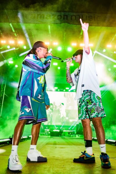 Vibra Urbana Miami 2022 Vibra Urbana Two artists singers rappers on stage lights